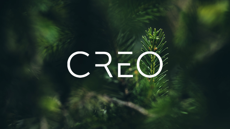 Creo capital Oy:n logo kuusitaustaa vasten